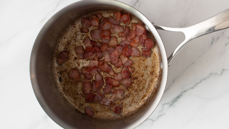 Diced bacon in saucepan