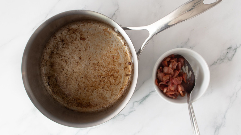 Saucepan and small bowl of bacon