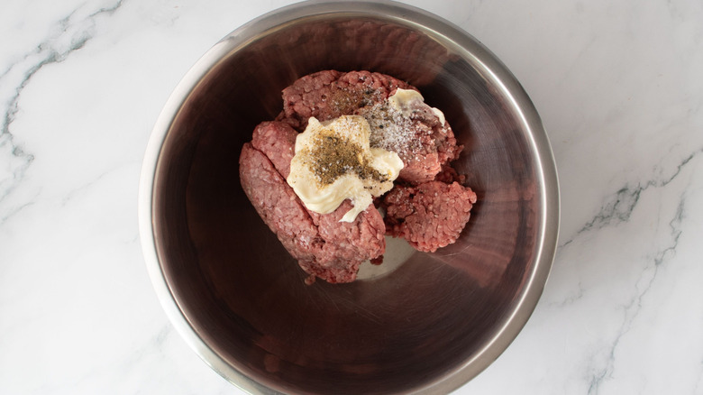 Ground beef, mayonnaise, and seasonings in bowl
