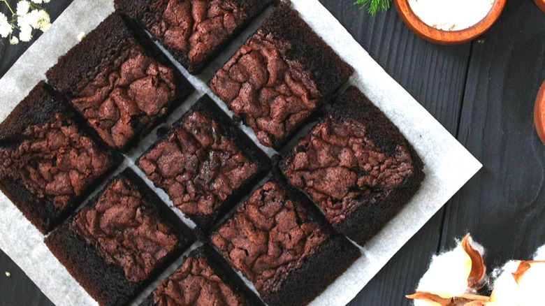 A plate of stacked chocolate brownies.