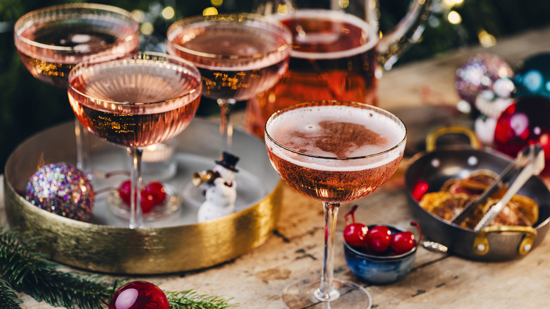 an arrangement of holiday cocktails in a festive set up