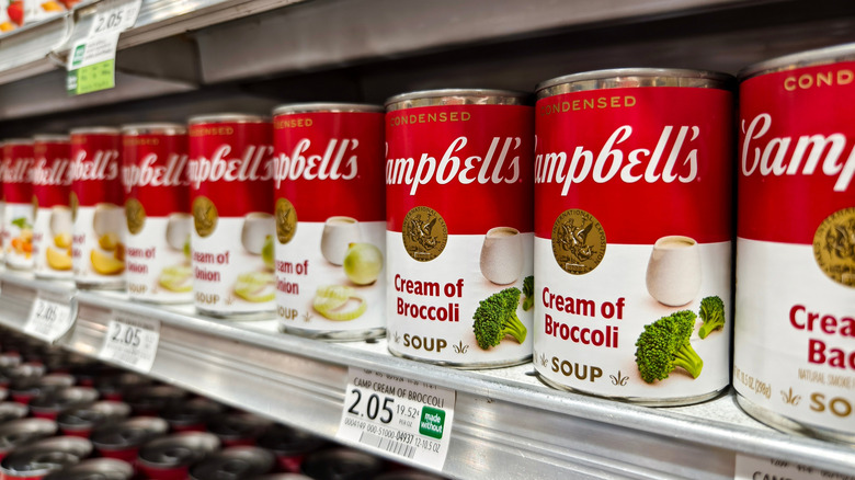 Campbell's cream soups, featuring cream of broccoli, on a grocery store shelf