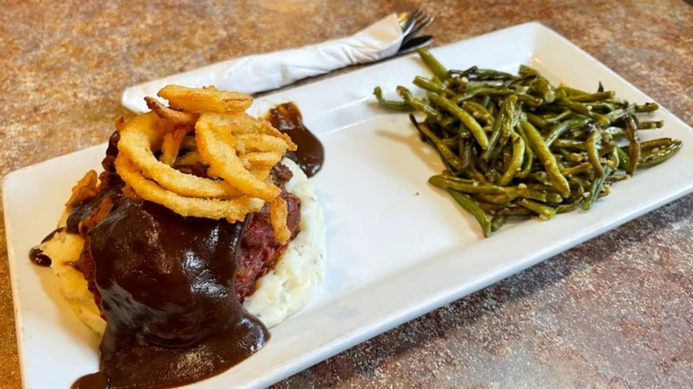 Perkins meatloaf topped with gravy and onion rings