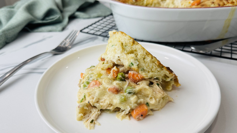 Cheesy creamy chicken cobbler serving on plate