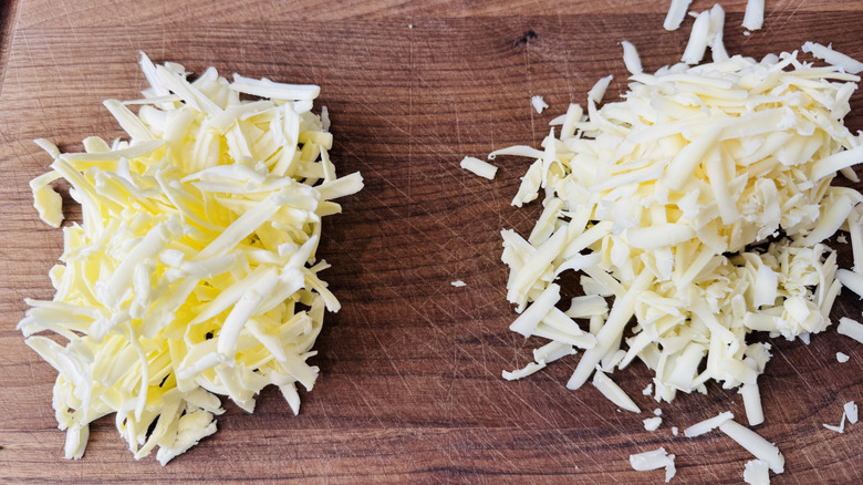 Grated cheese and butter on cutting board