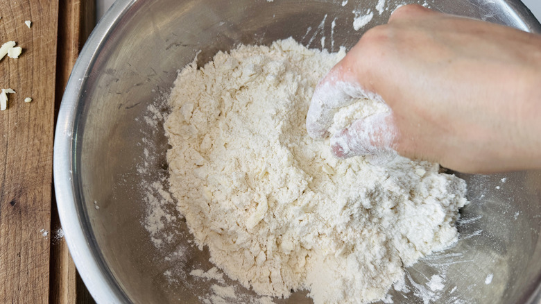 Rubbing butter into biscuit mixture