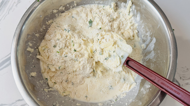 Mixing biscuit dough in bowl