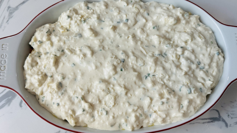 Biscuit dough spread over chicken cobbler