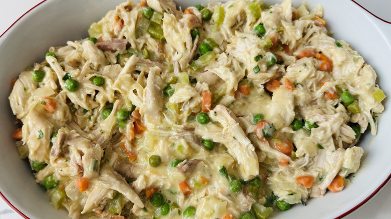 Creamy chicken cobbler base in baking dish