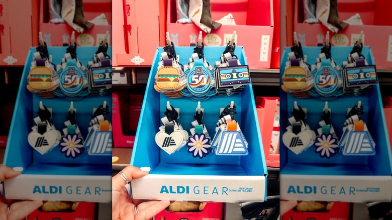 Aldi quarter holder keychains, styles including a burger, anniversary edition, cassette tape, heart, flower, and Aldi A