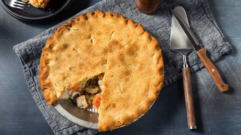 Chicken pot pie in a baking dish over a towel