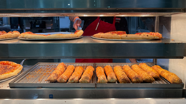 Costco food court menu items staying warm under a heat lamp
