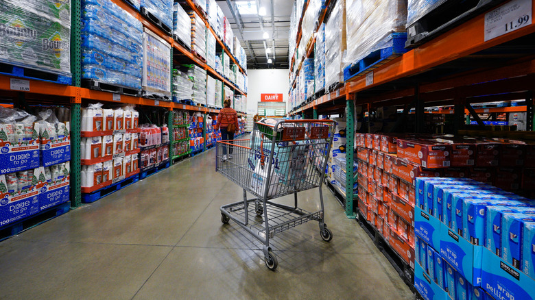interior of a Costco with shopping cart and products