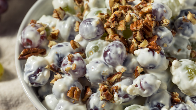 Close-up of a chopped pecan and grape salad
