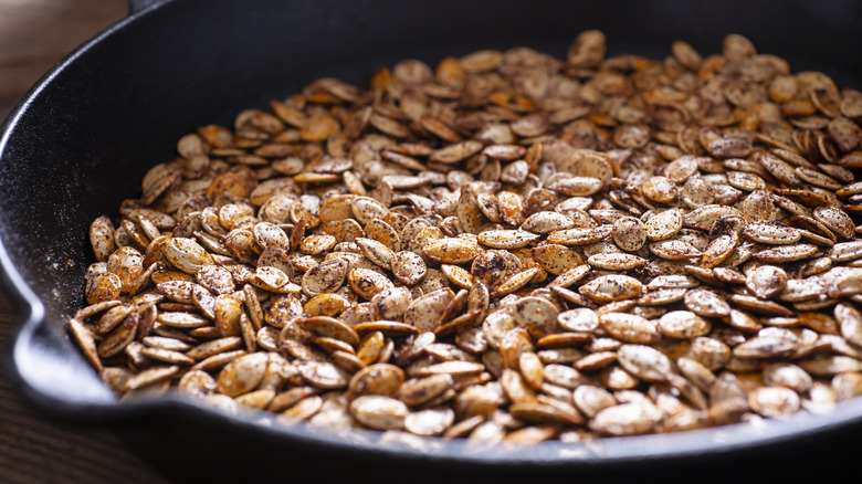 Toasted pumpkin seeds in a pan
