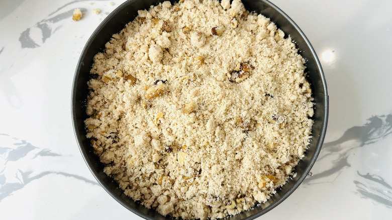 Crumb topping over cake batter in pan