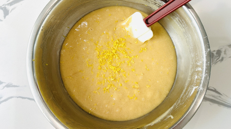 Folding lemon zest into cake batter