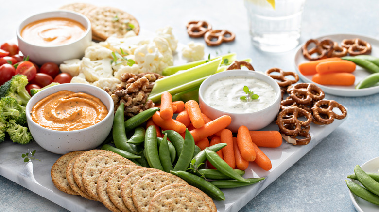 tray of snacks including pretzels and veggies