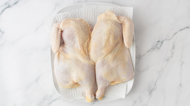 raw chicken on a white paper towel