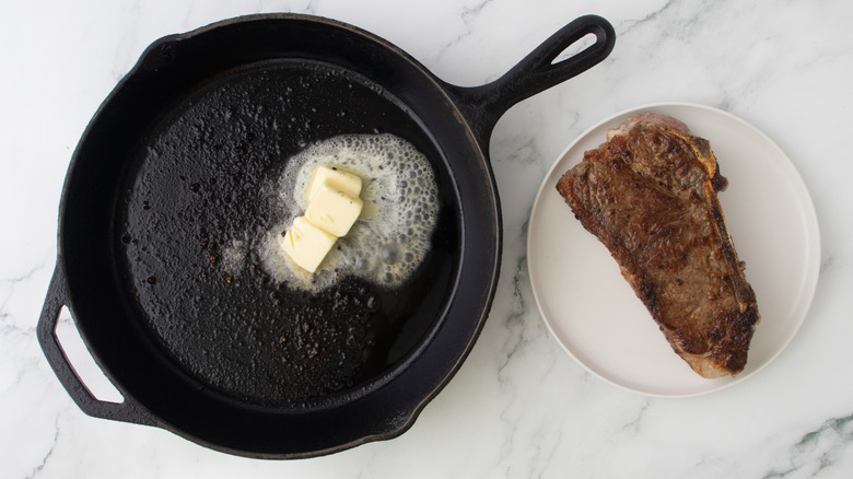 butter in a black frying pan