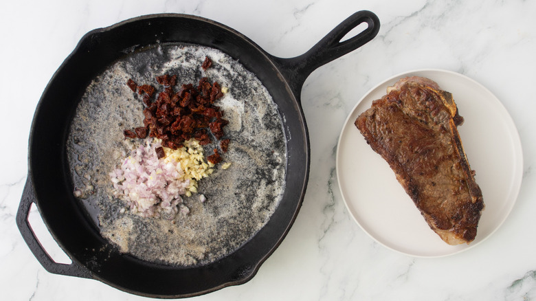 chopped vegetables in a black frying pan