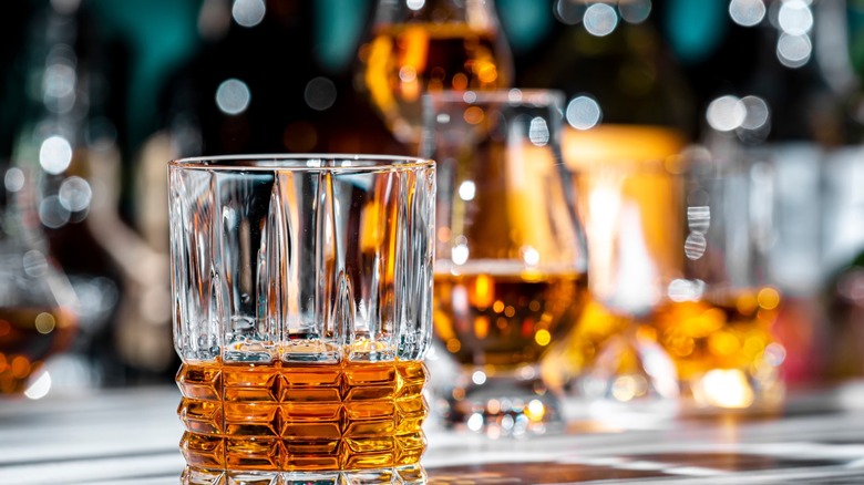 Glasses of bourbon on a countertop