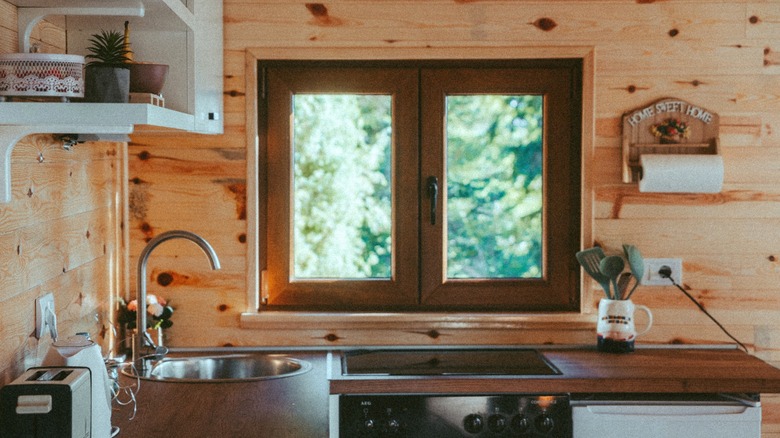A farmhouse style kitchen is awash in wood.