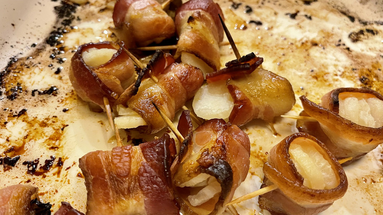 cooked rumaki skewers on plate