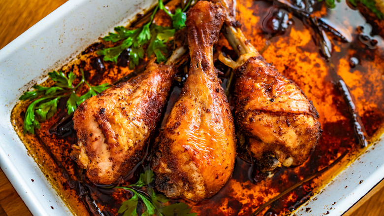 Dish of crispy chicken drumsticks.