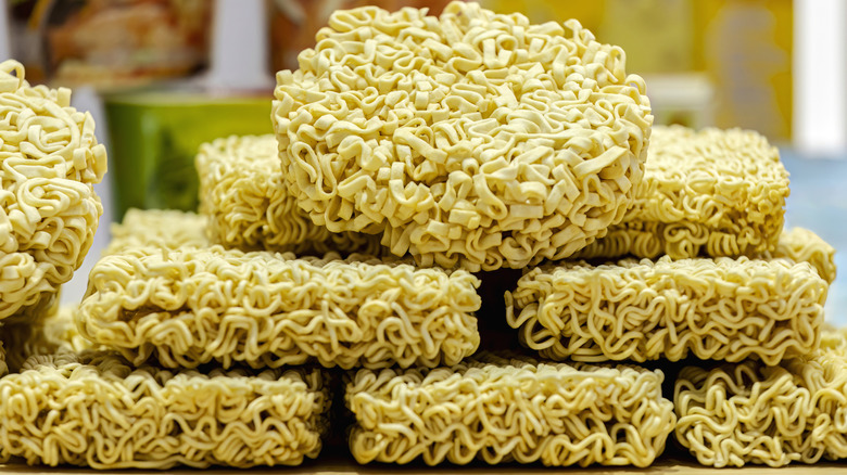 dry, instant ramen noodles stacked on top of each other