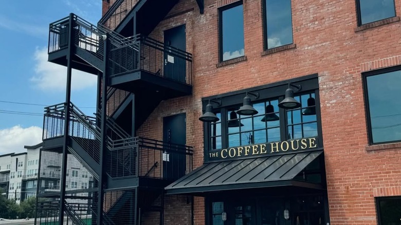 The facade of the red-bricked The Coffee House at West End captured on a sunny day.