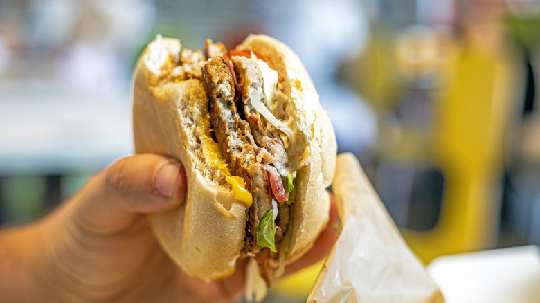 eating a fast food burger