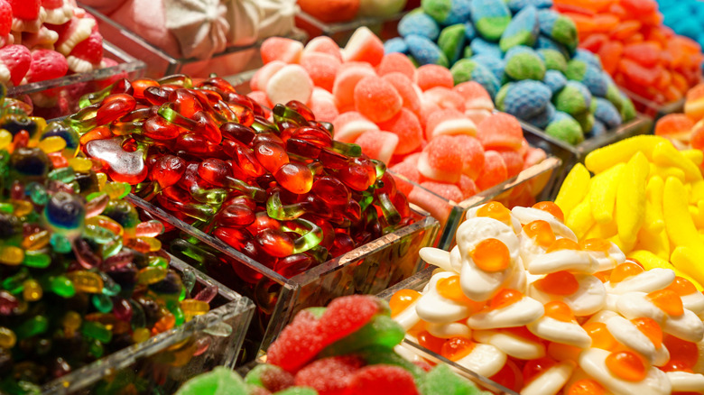 Piles of various candys on a shelf