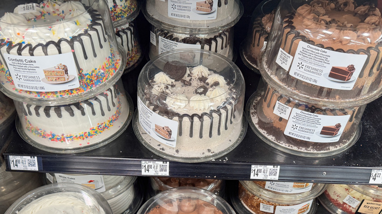 Display of decorated bakery cakes at a Walmart grocery store