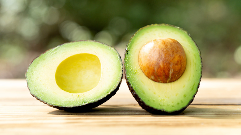 halved avocado sitting on a table