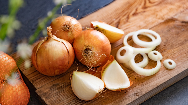 sliced onions on a cutting board