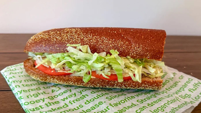 The Publix veggie sub on a wrapper on a wooden table