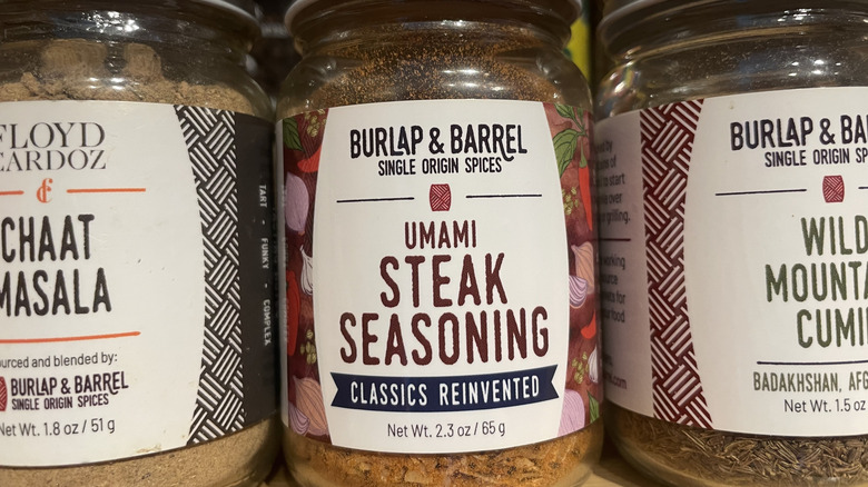 Burlap & Barrel's umami steak seasoning is pictured in a spice cabinet