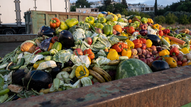 A dumpster full of produce