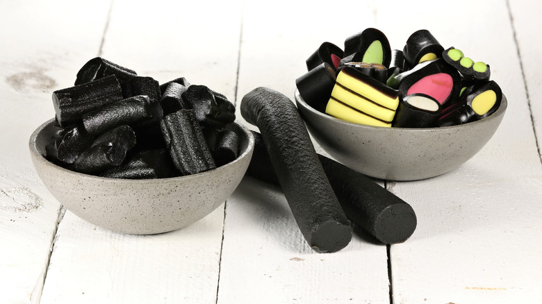 Two small bowls filled with a variety of licorice candies