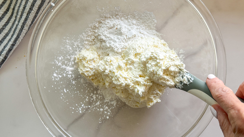 Cream cheese frosting ingredients in bowl