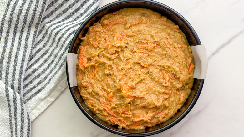 unbaked carrot cake batter in pan
