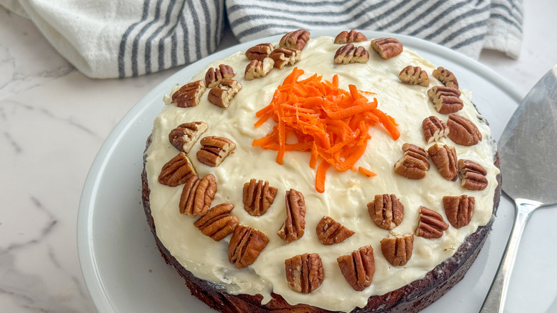 Decorated carrot cake on serving board