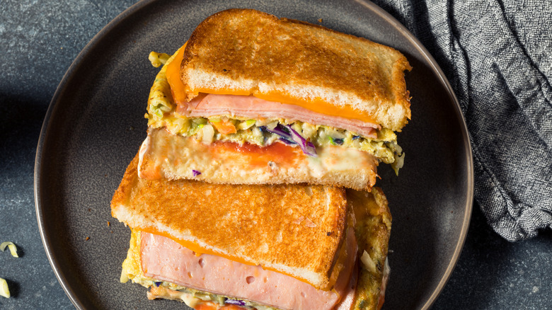 Korean gilgeori toast with ham and melted cheese on a plate