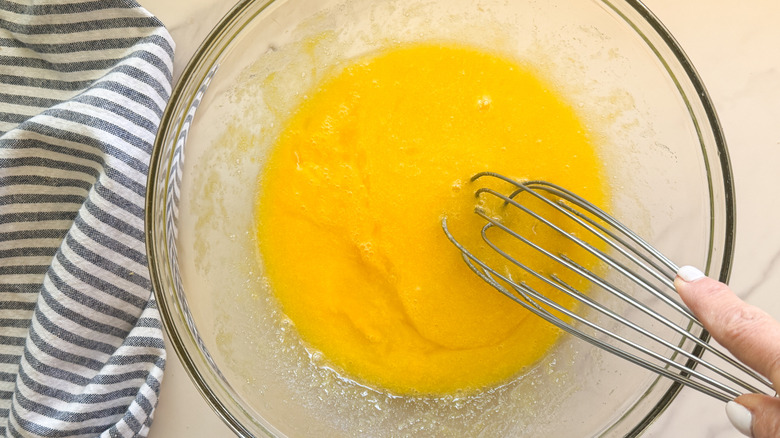 hand whisking eggs