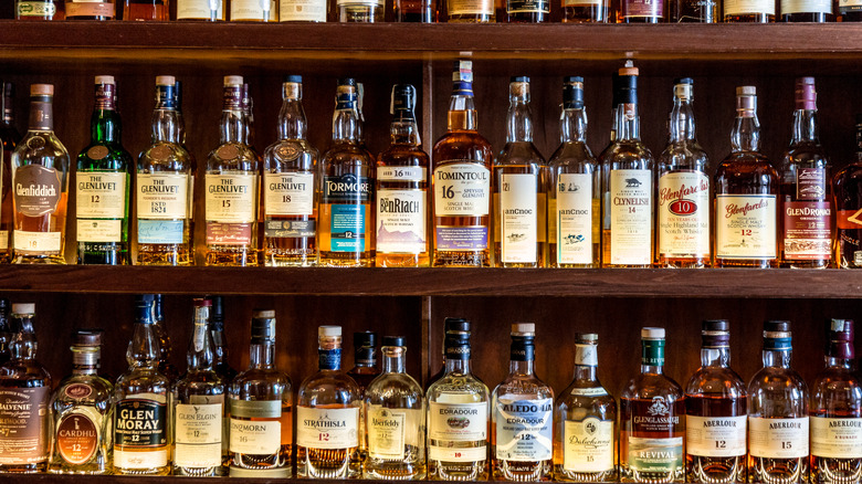 Bottles of scotch on a bar shelf