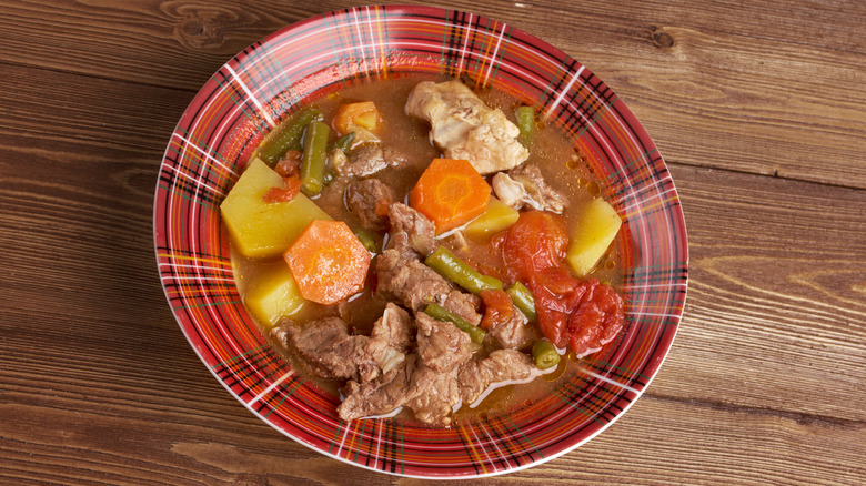 A bowl of booyah stew seen from above