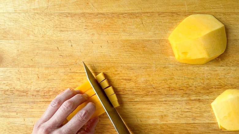 Dicing mango on a cutting board