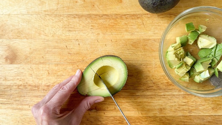 Scoring avocado flesh in the shells