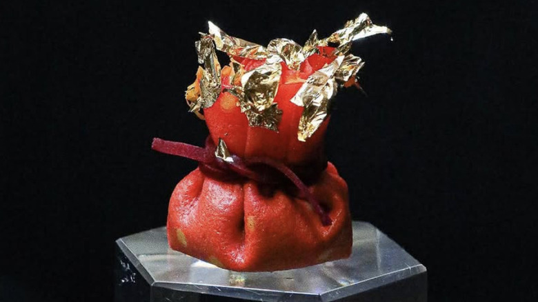 Pineapple and pearls first course dumping with black background.